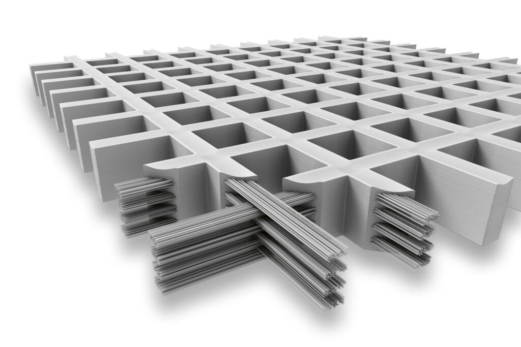 Querschnitt eines GFK-Rostes. An der vorderen Ecke kann man die Galsfasern sowie innerhalb des Produktes erkennen